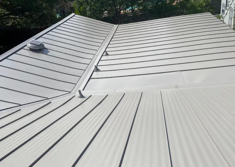 Solar attic fan installed on a metal roof for Roof Ventilation in Weldon Spring